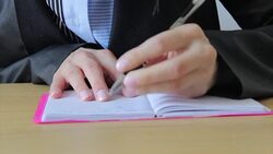 Left handed person writing Stock Footage