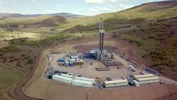Aerial View of a Fracking Drilling Rig in the Autumn Mountains of Colorado Stock Footage