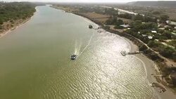 AERIAL boat on estuary/ Port Elizabeth/ South Africa Stock Footage