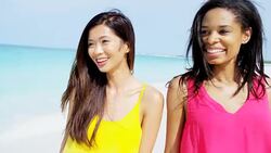 Smiling carefree multi ethnic female on vacation beach Stock Footage