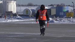 Airport worker stays positive in Midwest cold snap Instructional Video