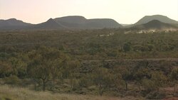 Car driving in the distant landscape, Purnululu National Park, Western Australia Stock Footage