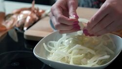 Woman preparing onion Stock Footage
