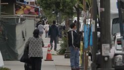 People walking in a Latino neighbourhood in Los Angeles News Clip
