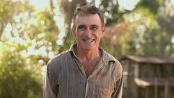 Middle aged farmer on farmland Stock Footage