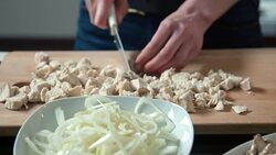 Woman cutting chicken meat Stock Footage