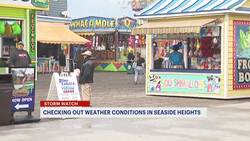 Last-minute beachgoers in Seaside Heights brave the rainy, gloomy weather News Clip