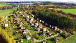 Camera flight over area for pleasant living in suburban district. Urban landscape in Czech Republic, Europe. Stock Footage