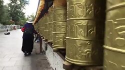 Prayers spinning the prayer wheels. Stock Footage