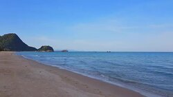 Close Up Shot of Waves Rolling Up White Sand Beach with soft smooth foam bubble sea water background. Stock Footage