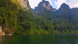 view of landscape limestone mountain rang and green forest with water lake Stock Footage