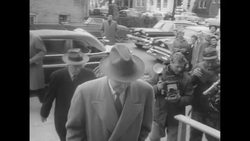 Pres. Eisenhower conducts his work at the Federal Post Office in Gettysburg, going over reports with Secy of State Dulles News Clip
