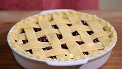 Preparing at home fresh and sweet homemade cherry pie on a kitchen. Stock Footage