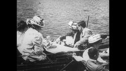 United States, 1930s-1940s: A factory worker drives a completed car onto a track where he stops to have the tire tread read by a tire tester Stock Footage