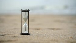 4k Sand clock on the beach, business concept teamwork & time management Stock Footage