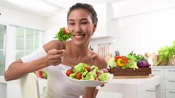 Beautiful Young woman eating salad Stock Footage
