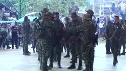 VOICED : Guerrilleros paralizan pueblo de Colombia por funeral de un jefe rebelde News Clip