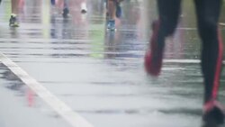 Marathon running in rain Stock Footage
