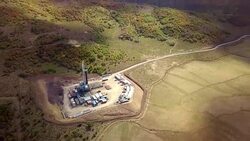 Aerial View of a Fracking Drilling Rig in the Autumn Mountains of Colorado Stock Footage