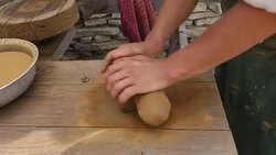 Potter kneads clay mass, preparing to make a ceramic pot or jug. Stock Footage