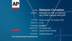 Malaysia ex-PM, ex-treasury, spy chiefs charged with graft Instructional Video