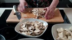 Woman cutting mushrooms Stock Footage