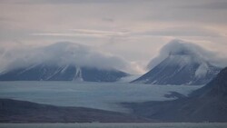 Clouds and mountains near Ny Alesund in Svalbard, Norway News Clip