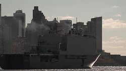 A military vessel steams out of New York City Stock Footage