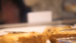 Showcase of cakes, breads,waffle, pastry in window display canteen for tasty desert food Stock Footage