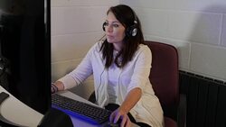 4K: Woman using Desktop Computer - Gaming or Editing Stock Footage