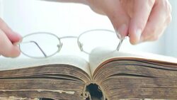 Glasses Placed on Vintage Book Stock Footage