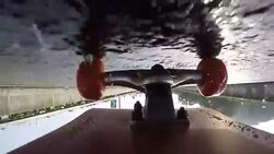 Under skateboard upside down POV - A person skating on a highway road Stock Footage
