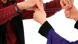 How to Escape from Rubber Band Cuffs Office Magic Trick Instructional Video