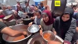 Desperate Palestinians queue for food at soup kitchen during Eid al-Adha News Clip