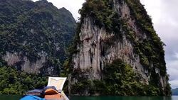 Moving follow boat with Beautiful mountains lake river sky and natural attractions in Ratchaprapha Dam at Khao Sok National Park, Surat Thani Province, Thailand. Stock Footage