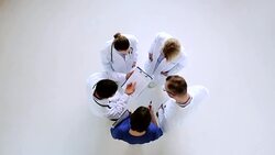group of doctors with clipboard talking at clinic Stock Footage