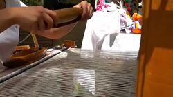 Woman hands weaving traditional carpet, closeup Stock Footage