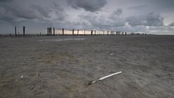 Storm clouds moving in over the Wadden sandflats in the Dutch Waddensea region in the North of The Netherlands. Stock Footage