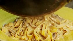 Slow motion of fettuccine with alfredo mushroom sauce Stock Footage