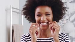 Perfect your smile by flossing regularly Stock Footage