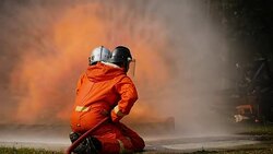 Firefighters fighting a fire operation, Water spray by high pressure nozzle to fire surround with smoke, Firefighters extinguish a car Stock Footage