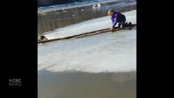 #TheMoment a man rescued his dog from a frozen river News Clip