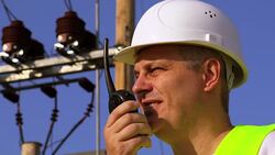 Electrician speaks the walkie-talkie close up Stock Footage