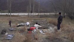 CLEAN : Karabakh: Armenian family digs up remains of loved one ahead of Azerbaijan takeover News Clip