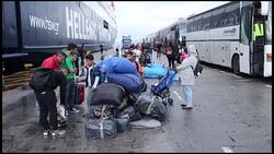 400 refugees left Moria camp arrive Piraeus Stock Footage