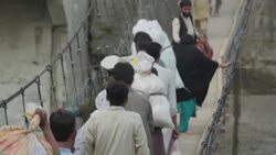 PAKISTAN: Sky visits the town of Bahrain in the mountainous Swat Valley in northern Pakistan which has been devastated during floods.  Some aid IS getting through there -- but it's nowhere near enough. News Clip