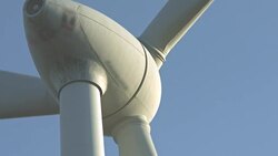 Wind turbines and agricultural fields on a summer day Stock Footage