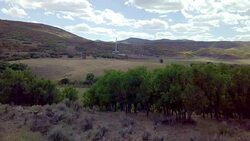 Aerial View of a Fracking Drilling Rig in the Autumn Mountains of Colorado Stock Footage