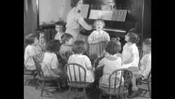 Children in chorus of Industrial School of Boston singing News Clip