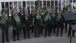 Women singing at Cheltenham Festival in celebration for St Patrick's Day News Clip